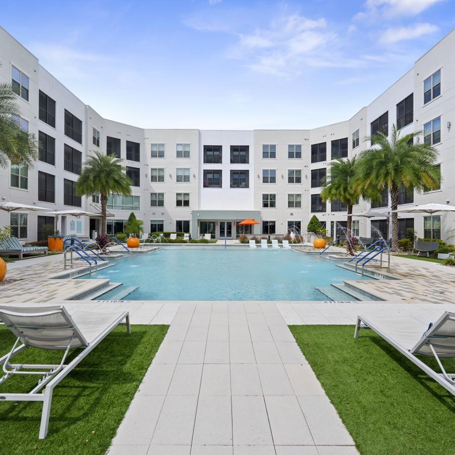 a pool with chairs around it