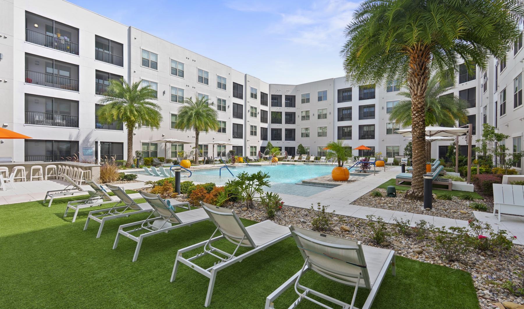 a pool with chairs around it