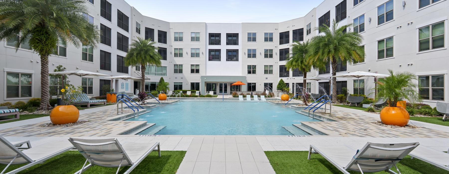 a pool with chairs around it
