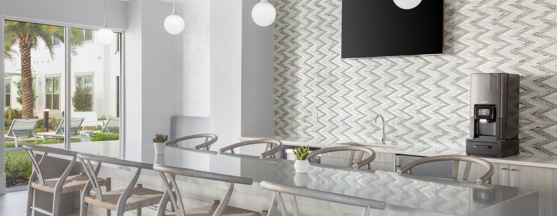 a kitchen with a large table and chairs