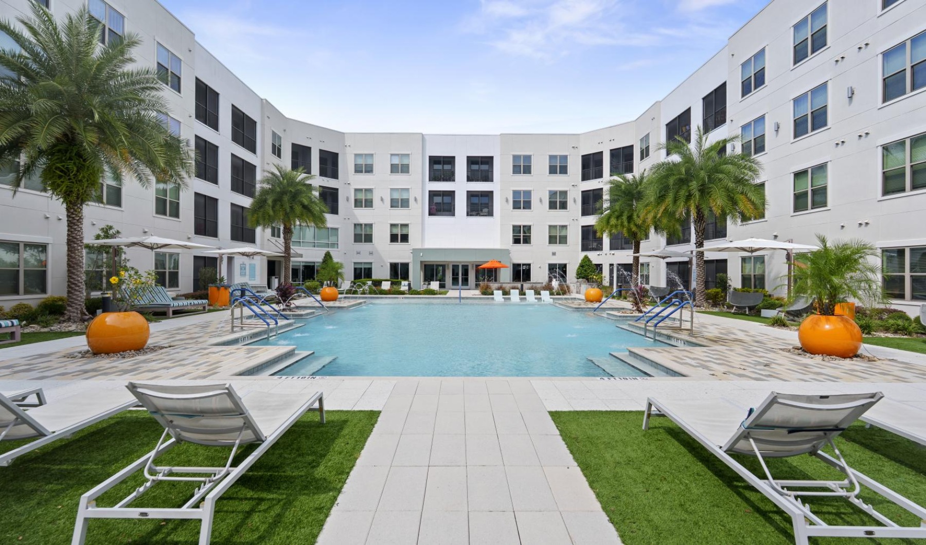 a pool with chairs around it